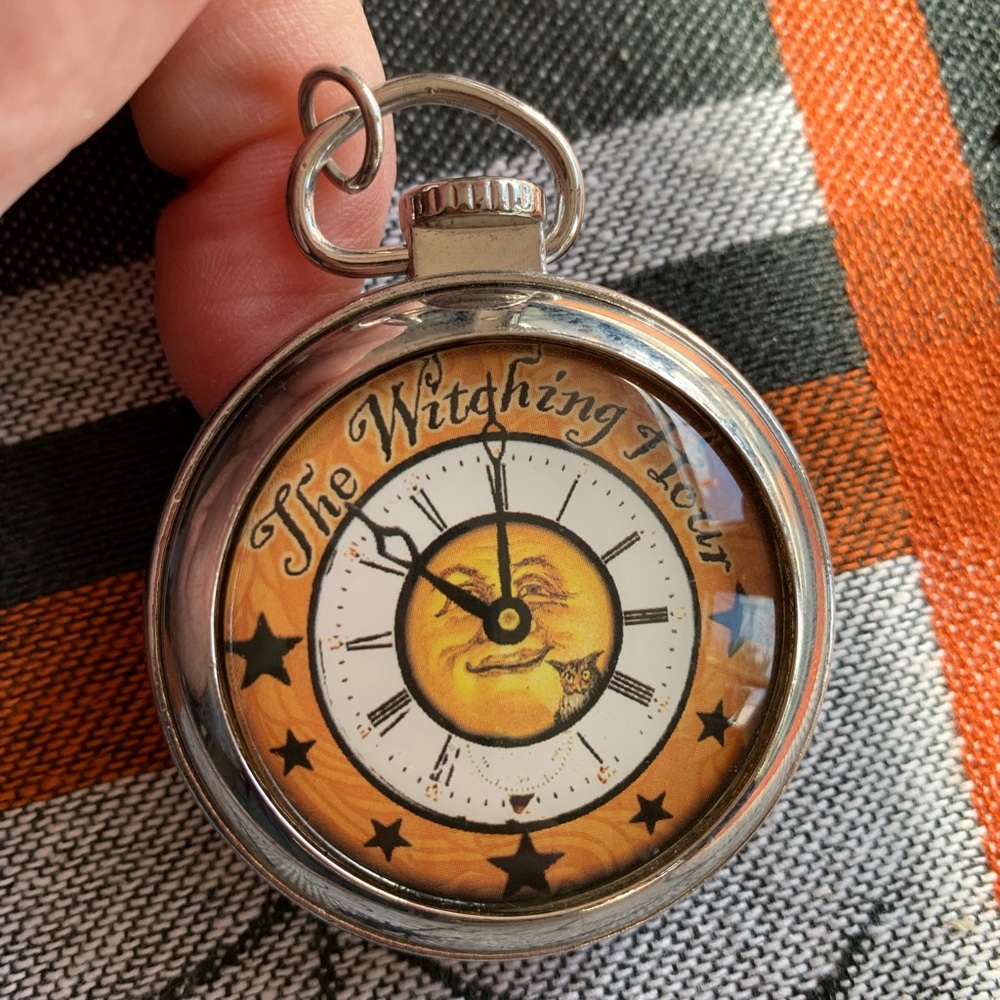 The Witching Hour Orange pocket watch charm. Is a charm only not a watch.